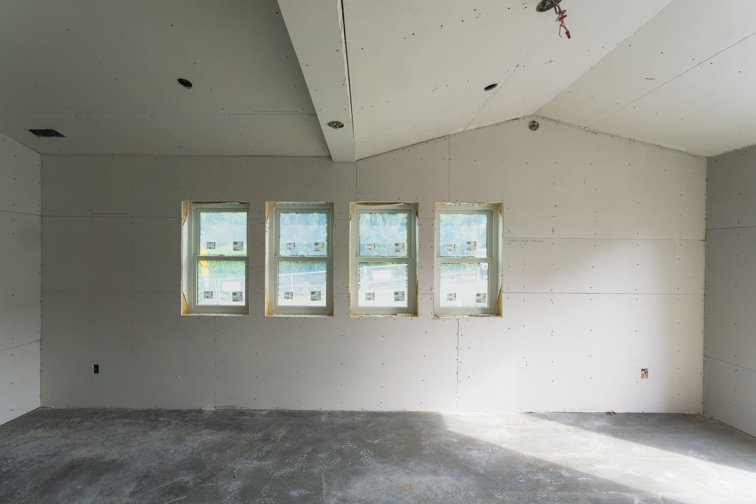 Freshly painted café service room—smooth drywall finish and primer/paint applied—Seattle.