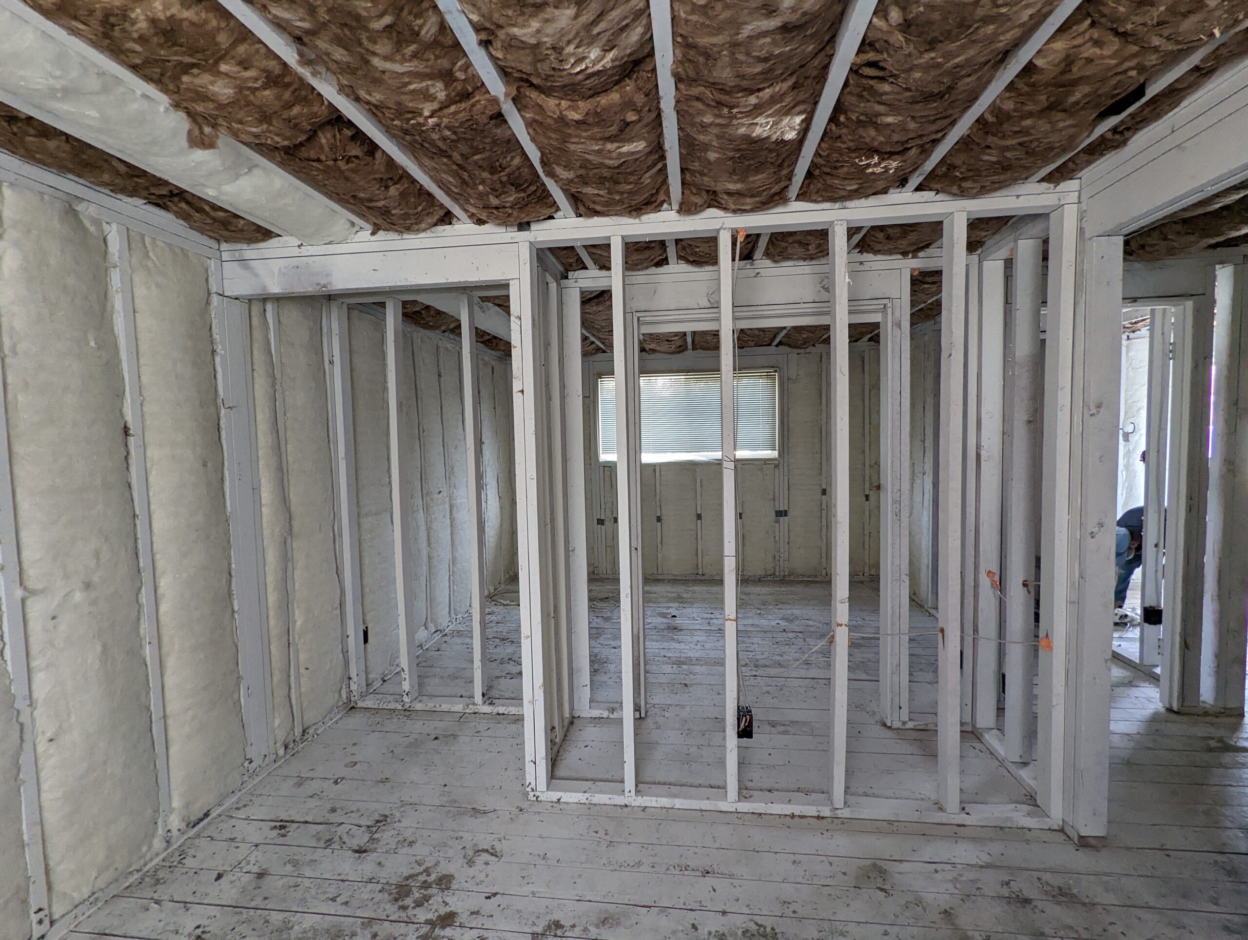 After smoke-seal: white-encapsulated walls and ceiling cavities for odor control