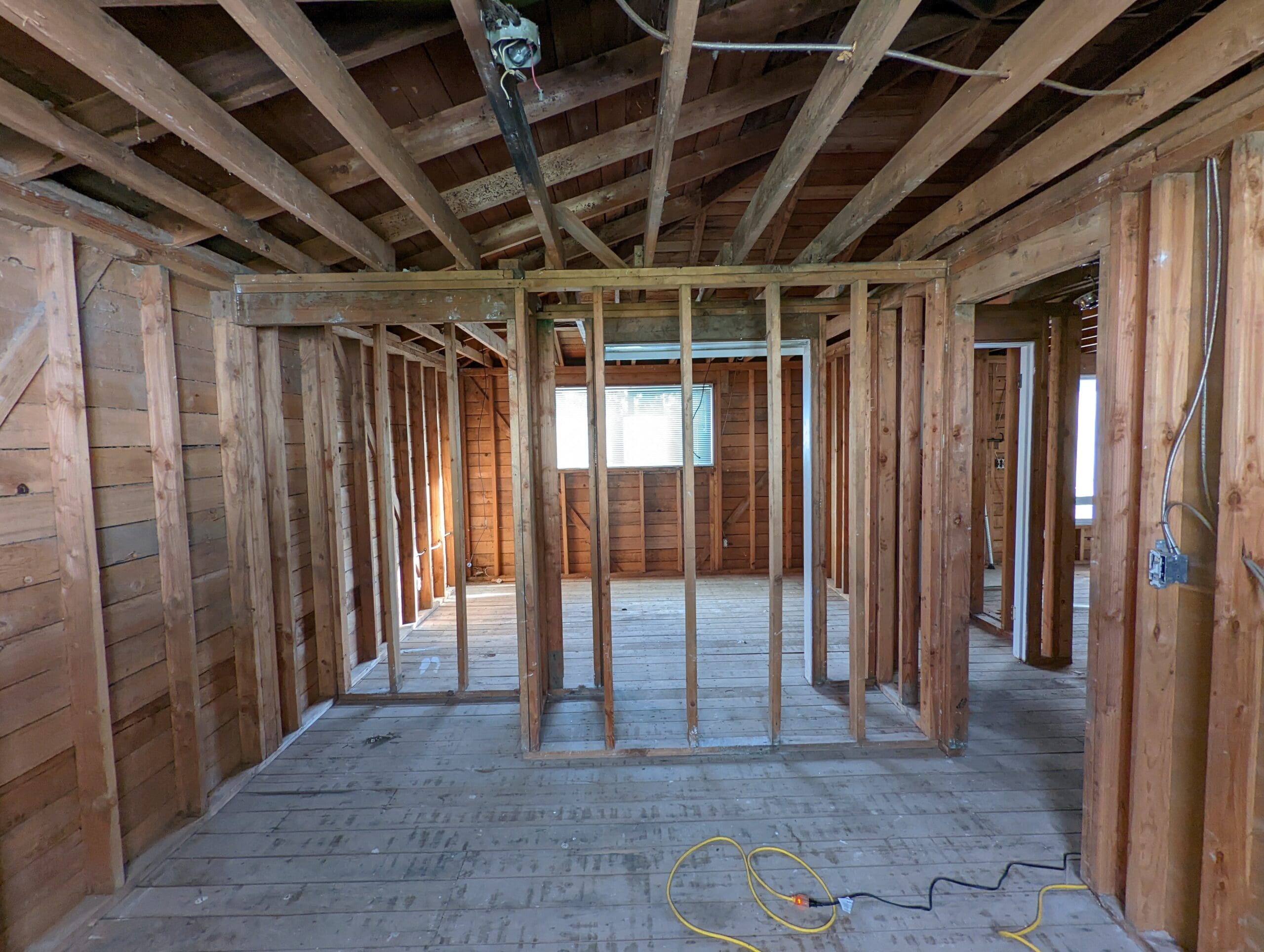 Before smoke-seal: exposed interior studs